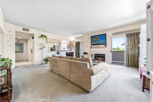 4591 Warner Ave Unit 105, Huntington Beach, CA 92649 - living room with light carpet and a tiled fireplace