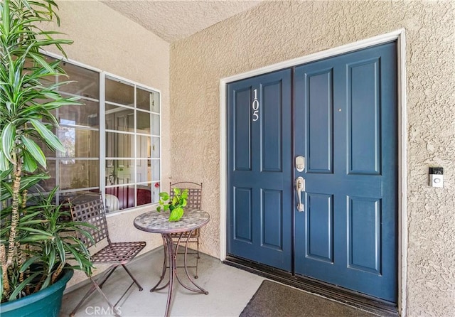 4591 Warner Ave Unit 105, Huntington Beach, CA 92649 - entrance to property with stucco siding