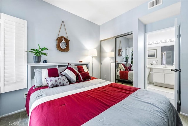 4591 Warner Ave Unit 105, Huntington Beach, CA 92649 - bedroom featuring carpet flooring, a closet, connected bathroom, and baseboards