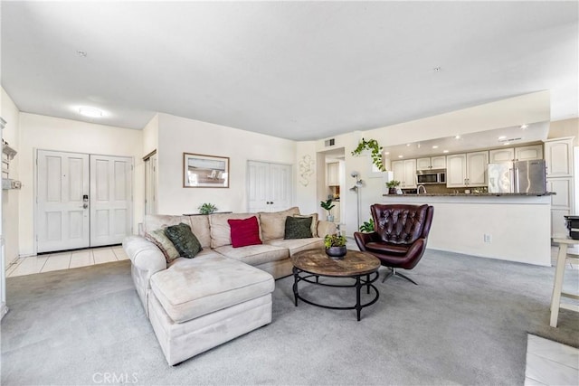 4591 Warner Ave Unit 105, Huntington Beach, CA 92649 - living room featuring light colored carpet and light tile patterned floors