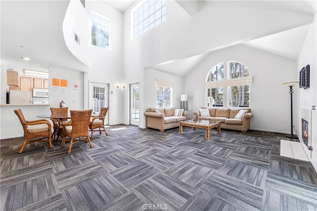 4591 Warner Ave Unit 105, Huntington Beach, CA 92649 - living room with dark colored carpet and high vaulted ceiling