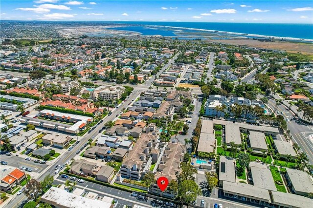 4591 Warner Ave Unit 105, Huntington Beach, CA 92649 - aerial overview of property's location featuring a large body of water and nearby suburban area