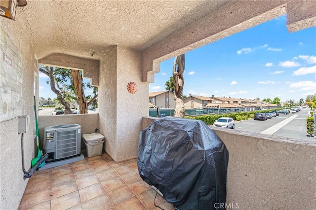 4591 Warner Ave Unit 105, Huntington Beach, CA 92649 - view of patio / terrace with central AC unit, area for grilling, and a residential view