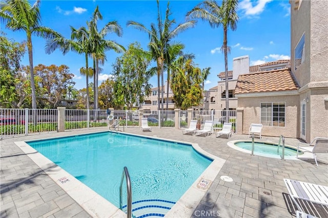 4591 Warner Ave Unit 105, Huntington Beach, CA 92649 - community pool featuring fence, a patio, and a community hot tub