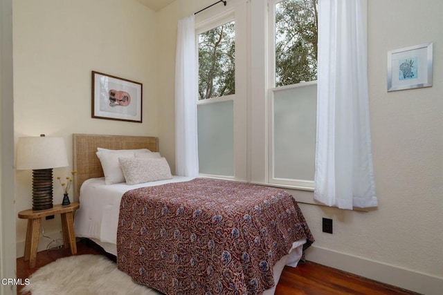 399 W Center St, Ventura, CA 93001 - bedroom with baseboards and wood finished floors