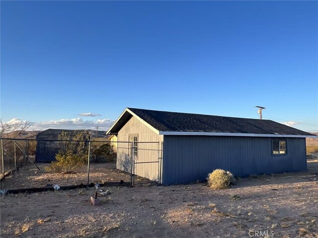 1754 Fortuna Ave, Landers, CA 92285 - view of home's exterior with fence and an outbuilding