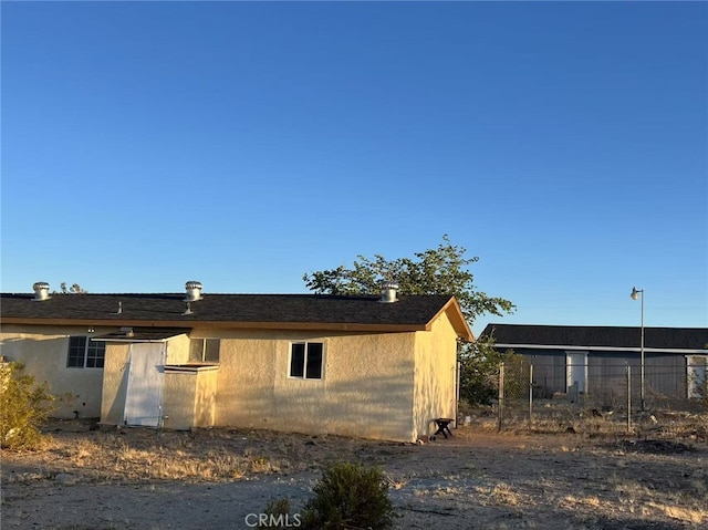 1754 Fortuna Ave, Landers, CA 92285 - view of side of property featuring fence and stucco siding