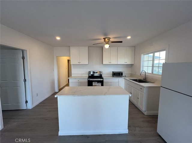 1754 Fortuna Ave, Landers, CA 92285 - kitchen featuring stainless steel appliances, a sink, white cabinetry, recessed lighting, and a center island