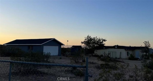 1754 Fortuna Ave, Landers, CA 92285 - view of front of house featuring fence, an attached garage, and an outbuilding