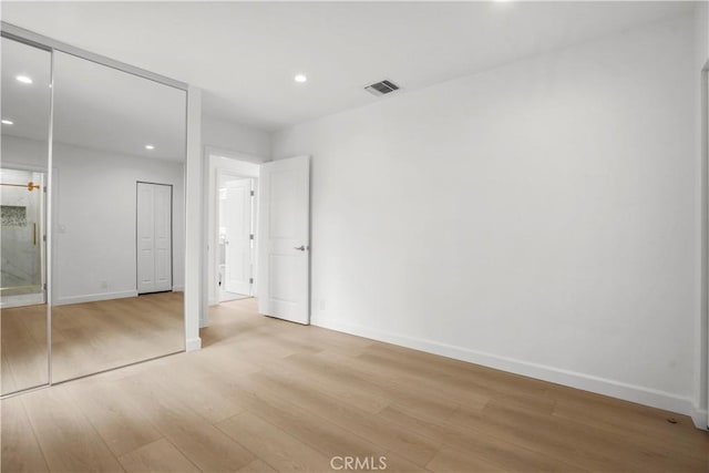 8331 Sharp Ave, Sun Valley, CA 91352 - unfurnished bedroom with light wood finished floors, recessed lighting, and baseboards