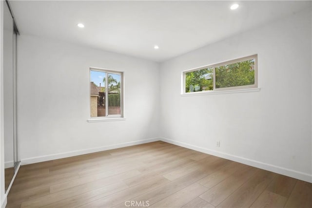 8331 Sharp Ave, Sun Valley, CA 91352 - empty room with plenty of natural light, light wood finished floors, recessed lighting, and baseboards