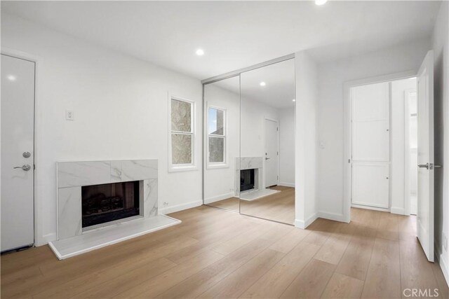 8331 Sharp Ave, Sun Valley, CA 91352 - unfurnished living room featuring a fireplace, wood finished floors, recessed lighting, and baseboards