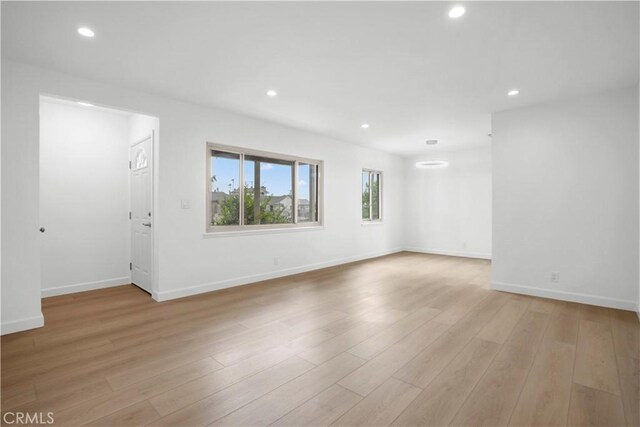 8331 Sharp Ave, Sun Valley, CA 91352 - unfurnished living room featuring recessed lighting, light wood-type flooring, and baseboards