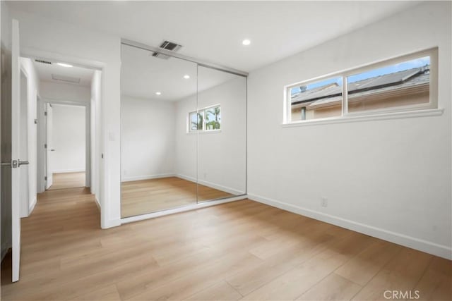 8331 Sharp Ave, Sun Valley, CA 91352 - unfurnished bedroom with baseboards, light wood-type flooring, a closet, recessed lighting, and attic access