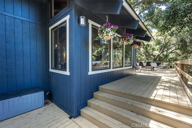 wooden terrace with an outdoor hangout area