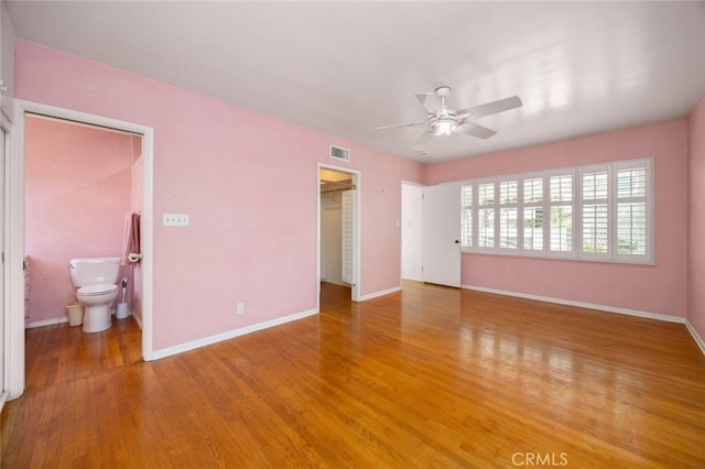 5422 E Harvey Way, Long Beach, CA 90808 - unfurnished bedroom with baseboards, light wood-type flooring, a spacious closet, a closet, and connected bathroom