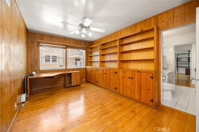 5422 E Harvey Way, Long Beach, CA 90808 - unfurnished office with ceiling fan, wood walls, light wood finished floors, and built in desk