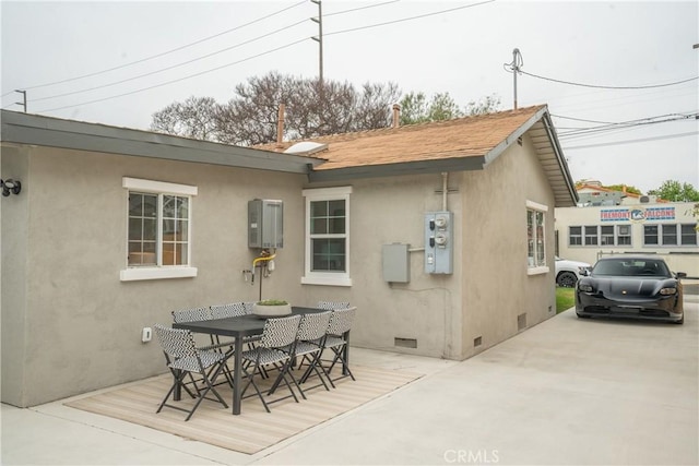 4110 E Vermont St, Long Beach, CA 90814 - back of house featuring crawl space, stucco siding, and outdoor dining area