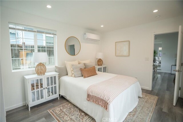 4110 E Vermont St, Long Beach, CA 90814 - bedroom with a wall mounted air conditioner, dark wood finished floors, recessed lighting, and baseboards