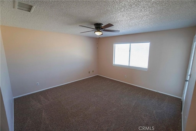 14410 Navajo Rd, Apple Valley, CA 92307 - spare room featuring a ceiling fan, dark carpet, baseboards, and a textured ceiling