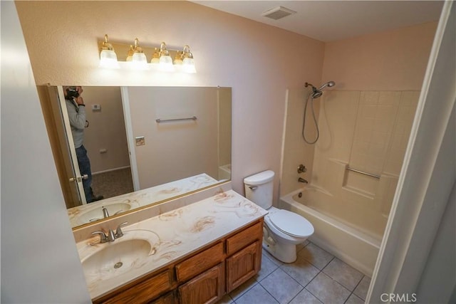 14410 Navajo Rd, Apple Valley, CA 92307 - bathroom with toilet, tile patterned floors, vanity, and shower / tub combination