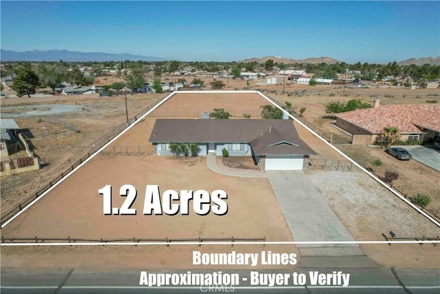 14410 Navajo Rd, Apple Valley, CA 92307 - view from above of property featuring a mountain backdrop