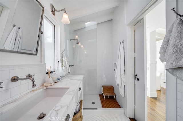 1651 Catalina, Laguna Beach, CA 92651 - bathroom with tiled shower, vanity, and beam ceiling