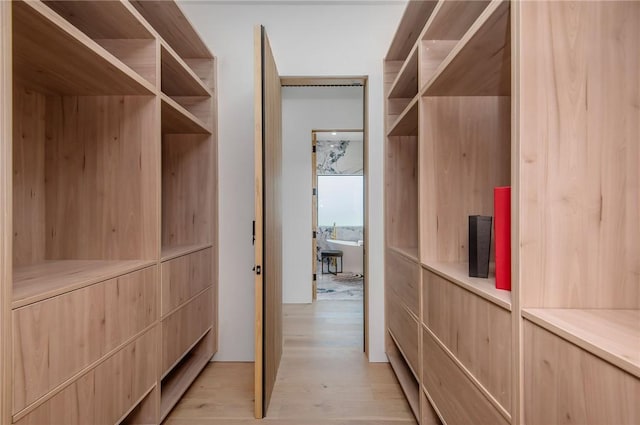 5132 Lindley Ave, Encino, CA 91316 - walk in closet featuring light wood-style floors