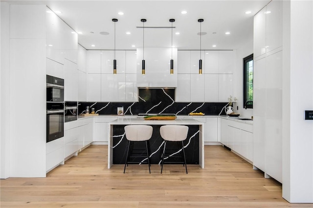 5132 Lindley Ave, Encino, CA 91316 - kitchen featuring modern cabinets, white cabinetry, a center island, and recessed lighting