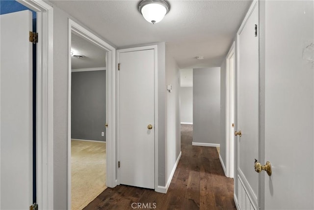2880 Foothill Blvd, Oroville, CA 95966 - corridor with a textured ceiling, dark wood finished floors, and baseboards