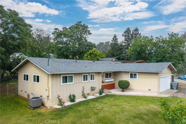 2880 Foothill Blvd, Oroville, CA 95966 - rear view of property featuring central air condition unit, a lawn, a shingled roof, and view of scattered trees