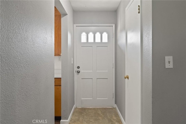 2880 Foothill Blvd, Oroville, CA 95966 - doorway with a textured wall and baseboards