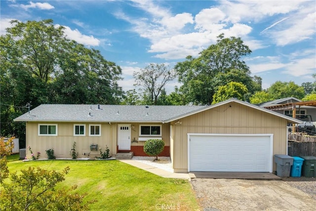 2880 Foothill Blvd, Oroville, CA 95966 - single story home with driveway, an attached garage, board and batten siding, cooling unit, and a shingled roof