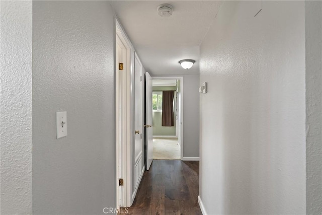 2880 Foothill Blvd, Oroville, CA 95966 - hall featuring dark wood finished floors, baseboards, and a textured wall