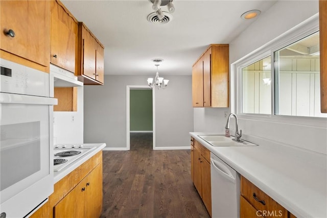 2880 Foothill Blvd, Oroville, CA 95966 - kitchen featuring a sink, white appliances, a chandelier, baseboards, and light countertops