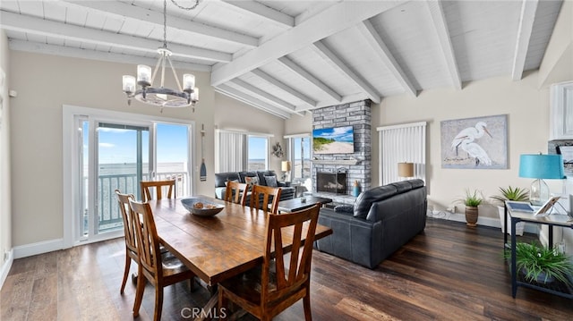 402 E Oceanfront, Newport Beach, CA 92661 - dining space featuring a fireplace, baseboards, a chandelier, dark wood-style floors, and wood ceiling