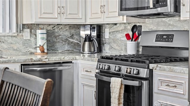 402 E Oceanfront, Newport Beach, CA 92661 - kitchen with appliances with stainless steel finishes, decorative backsplash, and white cabinetry