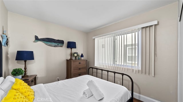402 E Oceanfront, Newport Beach, CA 92661 - bedroom featuring baseboards and wood finished floors