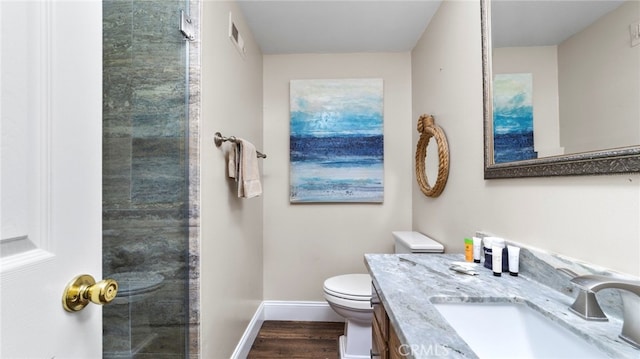 402 E Oceanfront, Newport Beach, CA 92661 - bathroom with wood finished floors, toilet, vanity, and baseboards
