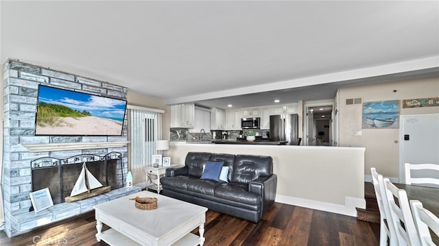 402 E Oceanfront, Newport Beach, CA 92661 - living room featuring wood finished floors and a stone fireplace