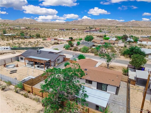 61461 El Reposo St, Joshua Tree, CA 92252 - aerial view of residential area with mountains and a desert landscape