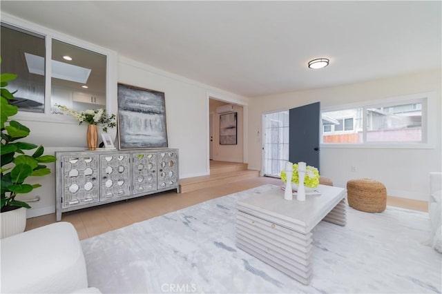 living area with wood finished floors and baseboards