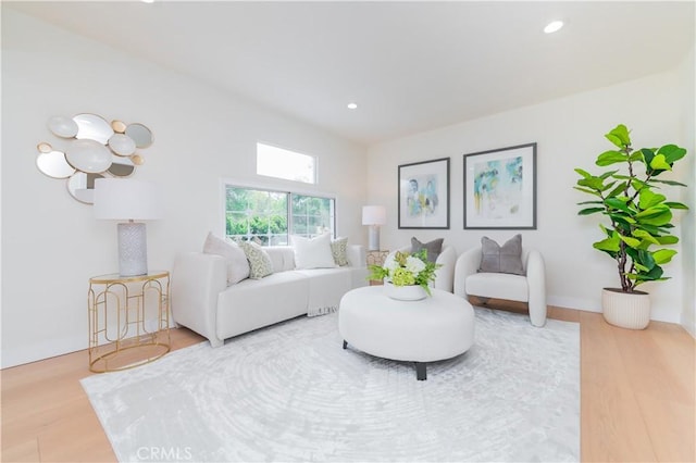 living room with wood finished floors and recessed lighting