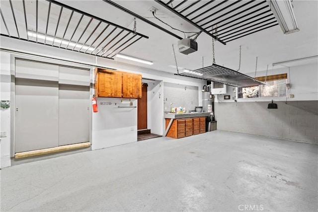300 Pioneer Rd, Lake Arrowhead, CA 92352 - garage featuring a garage door opener and concrete block wall