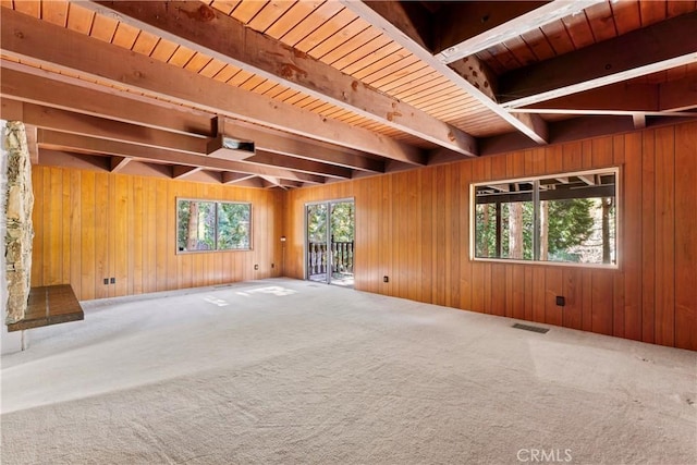 300 Pioneer Rd, Lake Arrowhead, CA 92352 - unfurnished living room with beamed ceiling, carpet flooring, plenty of natural light, wood walls, and wood ceiling