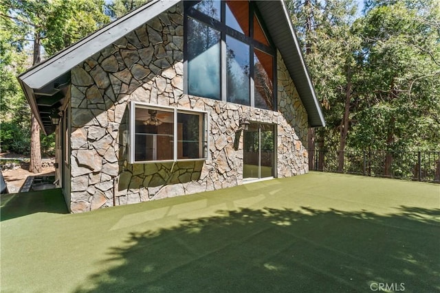 300 Pioneer Rd, Lake Arrowhead, CA 92352 - view of home's exterior featuring stone siding and fence