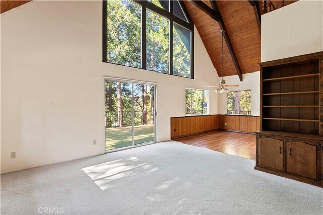 300 Pioneer Rd, Lake Arrowhead, CA 92352 - unfurnished living room featuring carpet floors, wooden ceiling, beam ceiling, high vaulted ceiling, and a ceiling fan