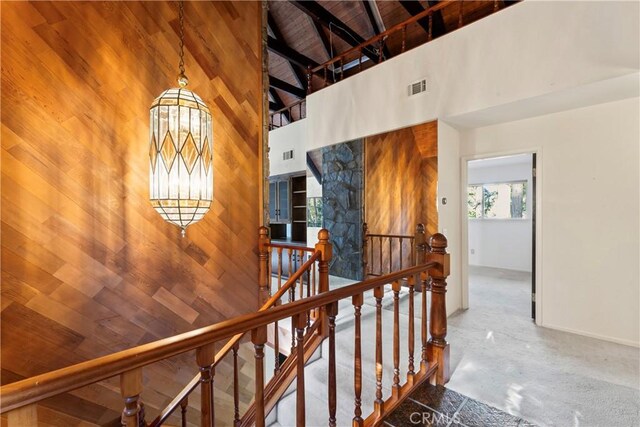 300 Pioneer Rd, Lake Arrowhead, CA 92352 - stairs with high vaulted ceiling, wood ceiling, wooden walls, a chandelier, and beamed ceiling