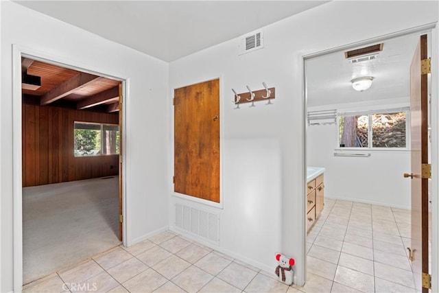 300 Pioneer Rd, Lake Arrowhead, CA 92352 - hallway with wooden walls and light tile patterned flooring