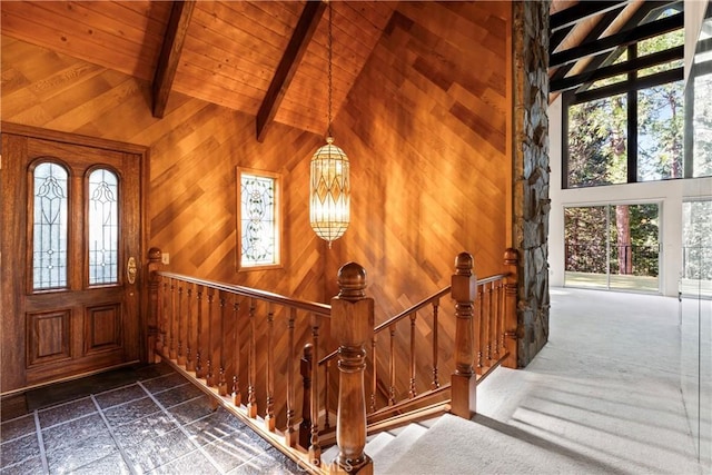 300 Pioneer Rd, Lake Arrowhead, CA 92352 - stairway featuring beam ceiling, high vaulted ceiling, wooden walls, wood ceiling, and stone tile floors